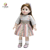 Cute girl doll with long brown hair in a fashionable floral dress 18136